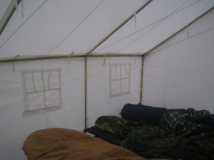 sleeping in a canvas tent