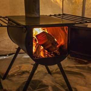 wood stove in canvas tent