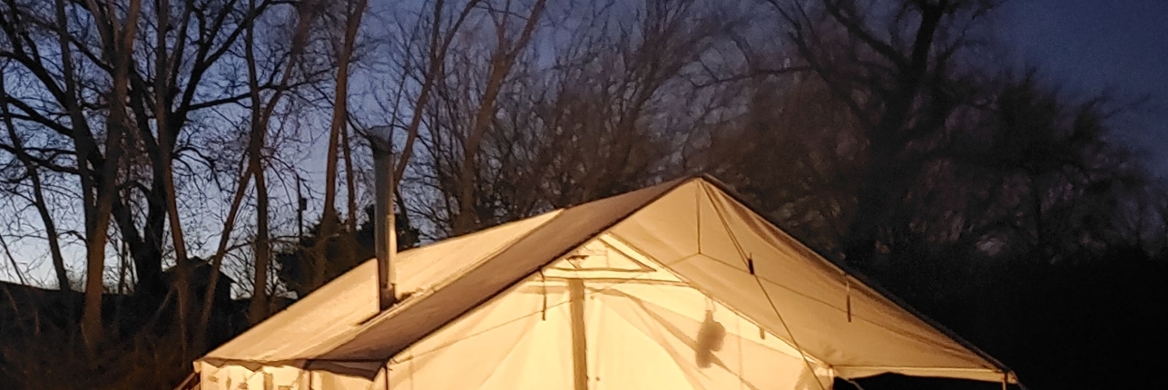 glowing tent with awning in the dark