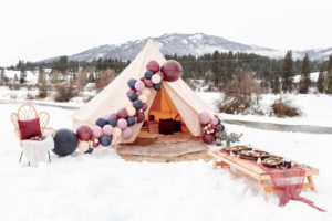 Luxurious Bell Tent for Comparison Page, Front of the tent features a decorative ballon arch in the snow